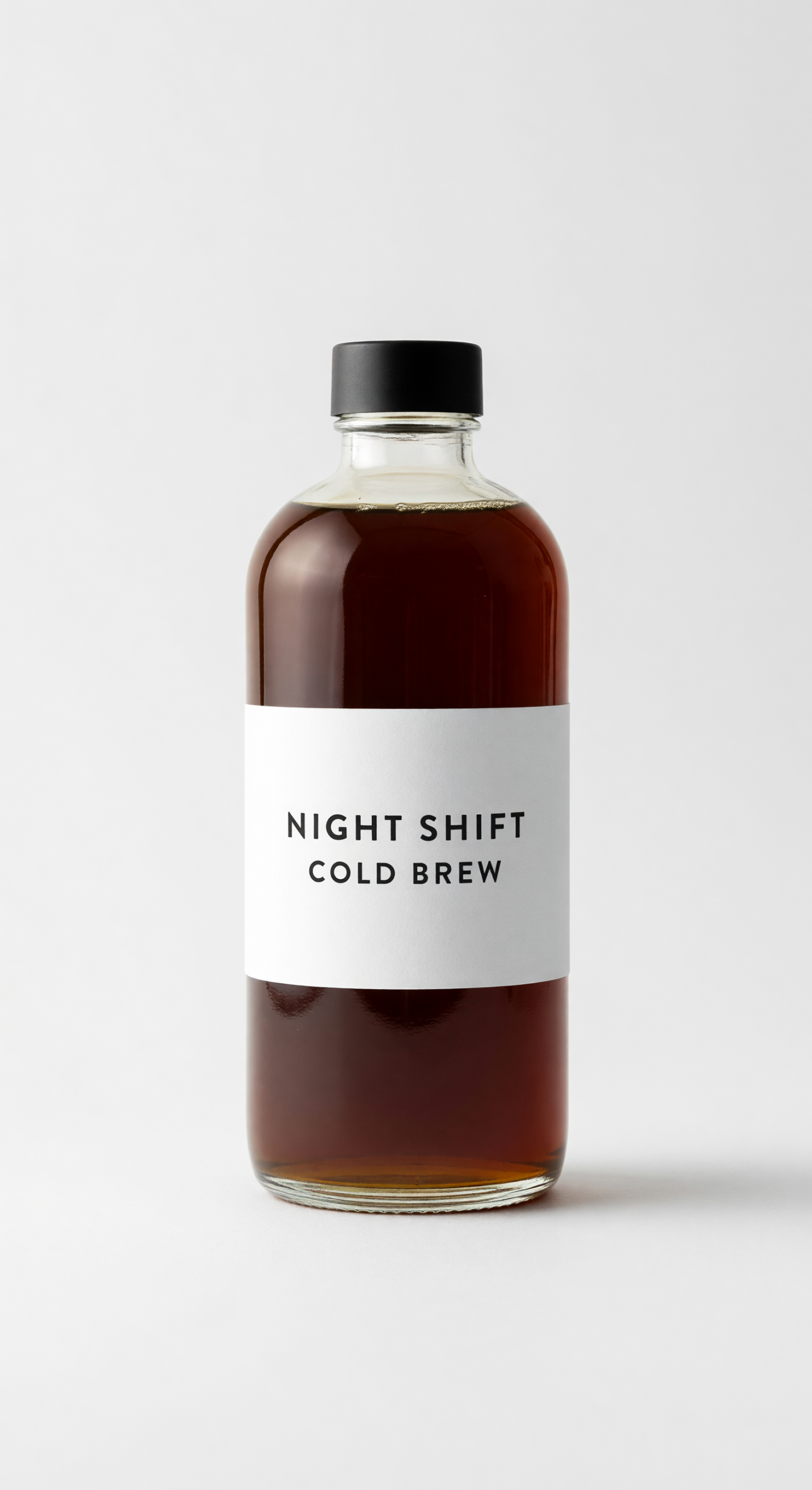 Grok Imagine Image output of a studio product photo of a glass cold brew bottle with the label NIGHT SHIFT and COLD BREW