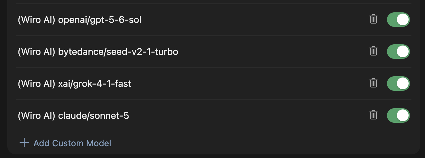 Cursor's custom model list showing four Wiro models, each carrying a Wiro prefix, with the Add Custom Model button below them.
